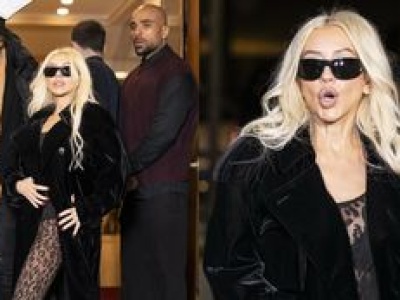 Elegancka i smuklejsza o 18 KILOGRAMÓW Christina Aguilera gra nogą przed wejściem do paryskiej restauracji. Klasa? (ZDJĘCIA)