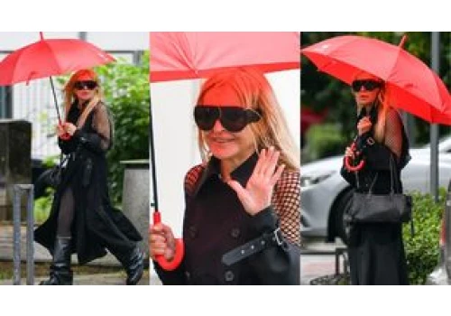 Monika Olejnik z torebką za 25 TYSIĘCY i w płaszczu za 9 tysięcy maszeruje w deszczu, uśmiechając się do paparazzi (ZDJĘCIA)